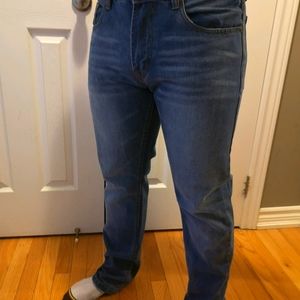 Men's slim cut faded blue jeans